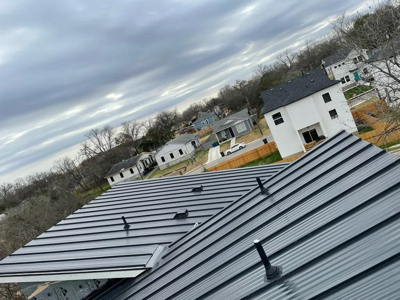 Standing seam metal roof panels with vents for Skylight Repair in McKinney